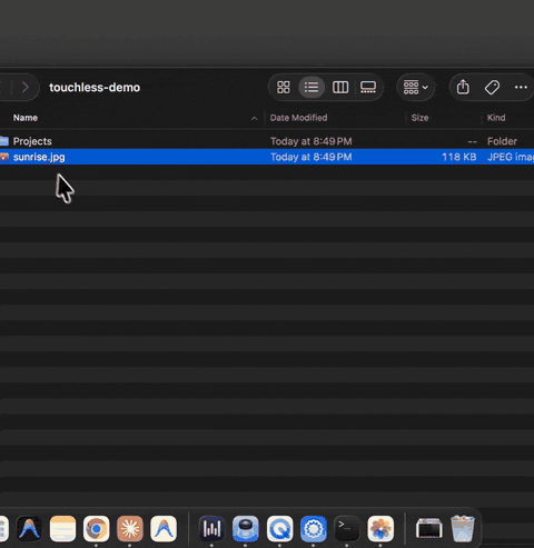 Screen recording of a real run: the cursor rests on a photo in Finder, a double pinch, and the photo opens in Preview
