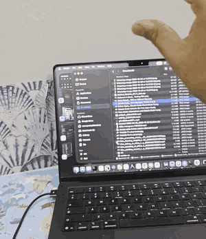 Filmed on a phone: thumb touches ring finger and the hand moves; the Finder list scrolls